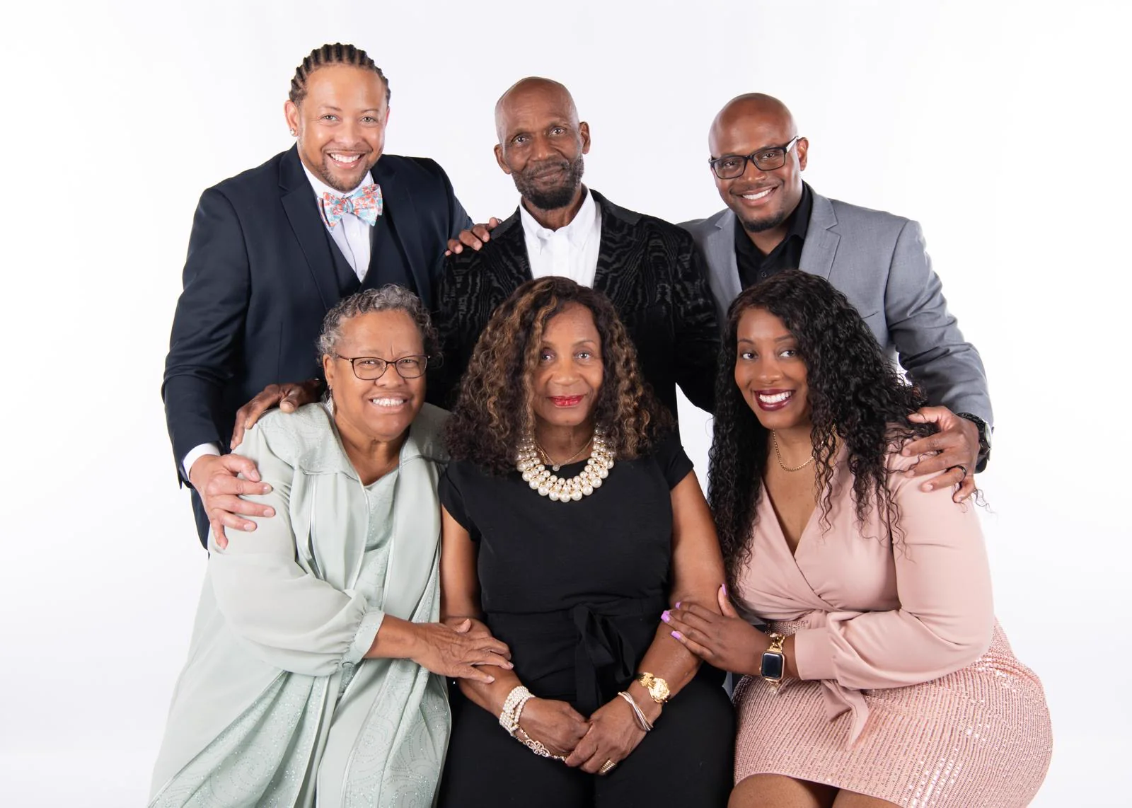 Dr. Patti Mills with family in a formal studio portrait